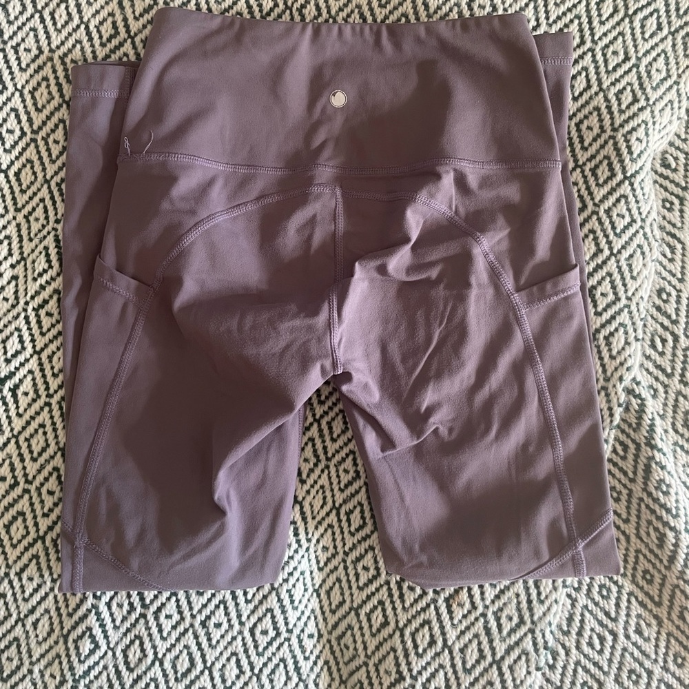 Purple leggings with side pockets